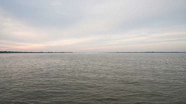 Empty Chesapeake Bay mainstem water at dawn with low haze over the channel
