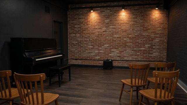 Piano and empty chairs in the Stoltz Listening Room at the Avalon Foundation