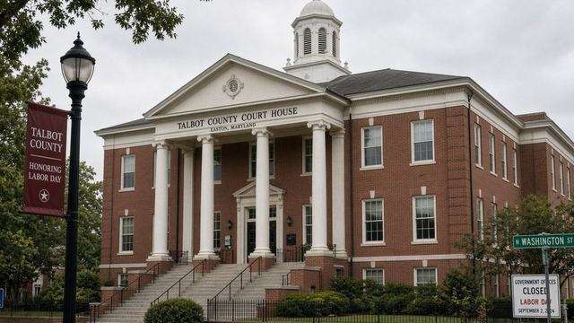 County office doors with Labor Day holiday notice