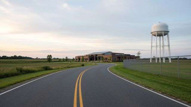Access road, medical building, and water tower on open county land near Easton