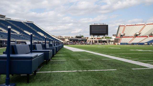 College football schedule board for a conference opener on the road