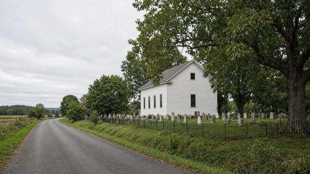White country church and graveyard at Unionville, empty of a crowd